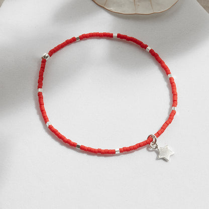 PULSERA ROJA ELASTICADA PLATA DIJE A ELECCIÓN