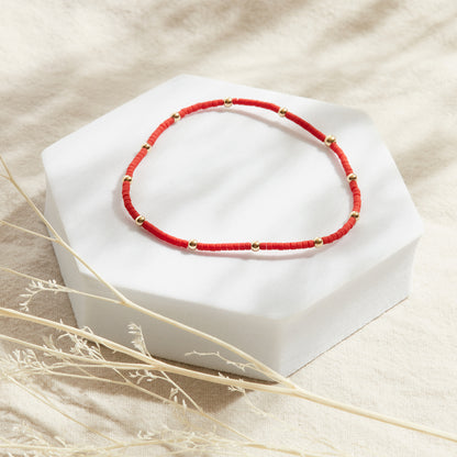 PULSERA ROJA ELASTICADA GOLDFILLED