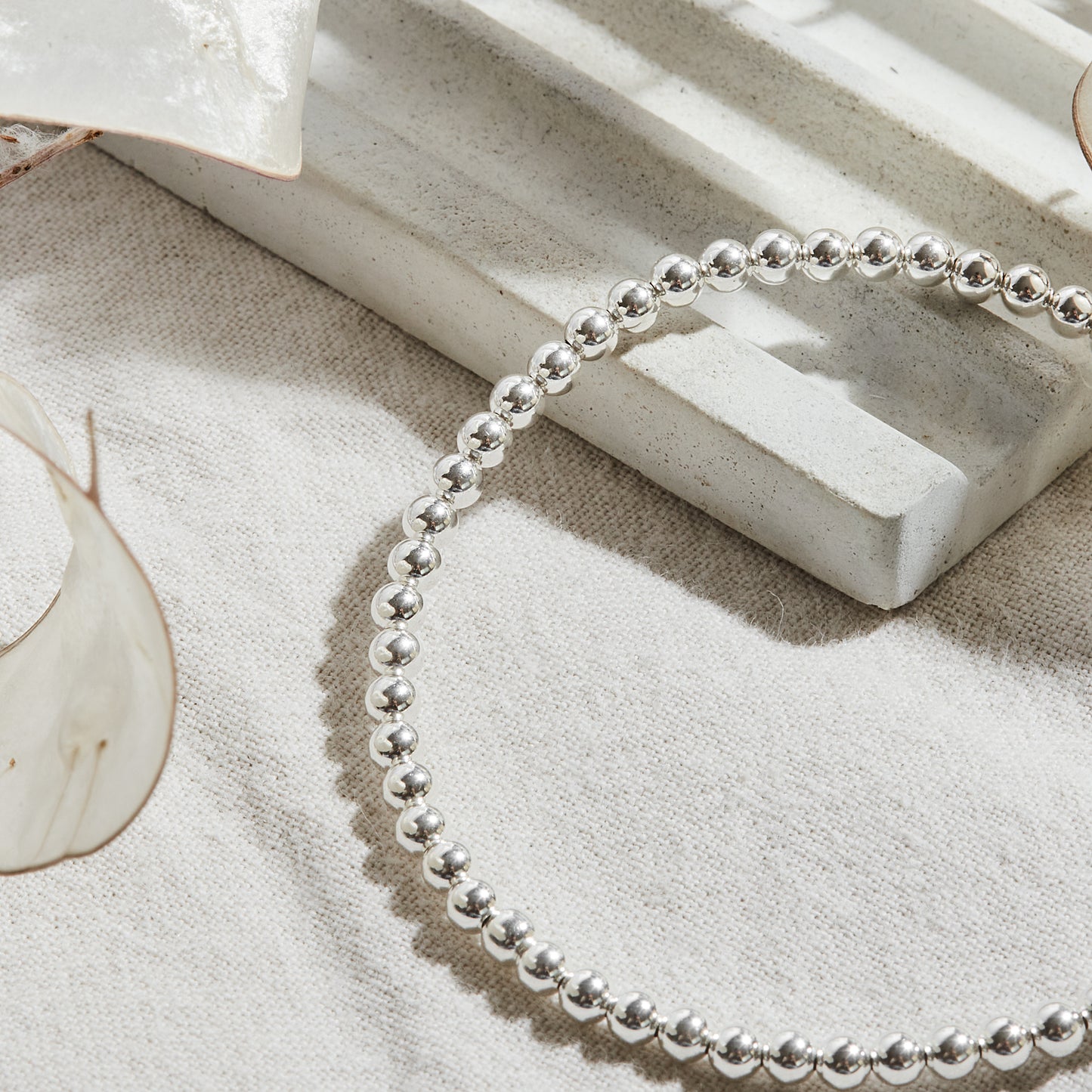 PULSERA ELASTICADA PLATA