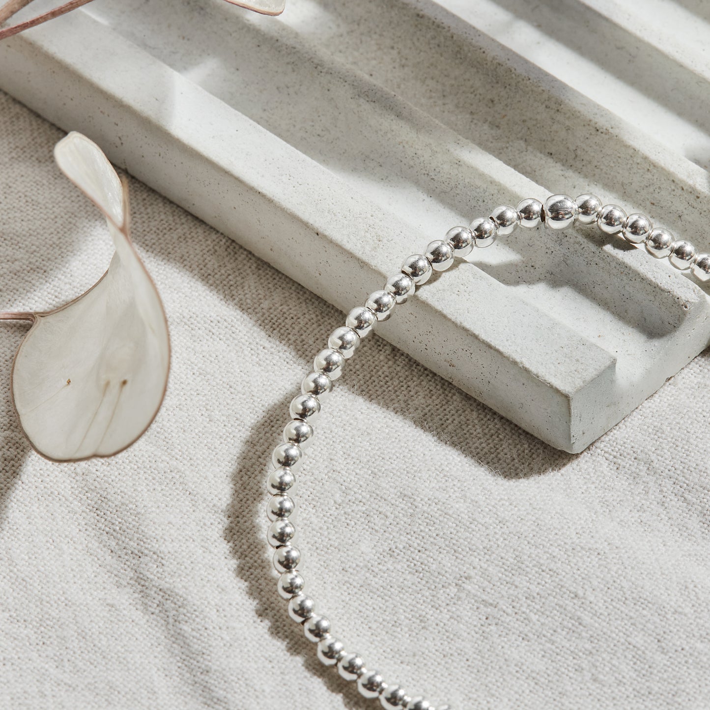 PULSERA ELASTICADA PLATA