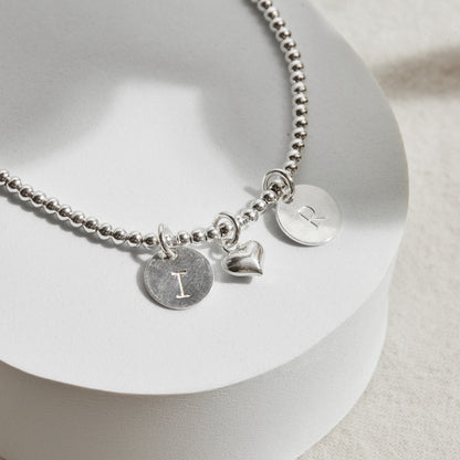 PULSERA BOLITA PLATA 950 INICIAL PLAQUITA