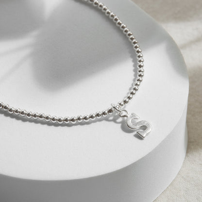 PULSERA ELASTICADA PLATA INICIAL FORMA