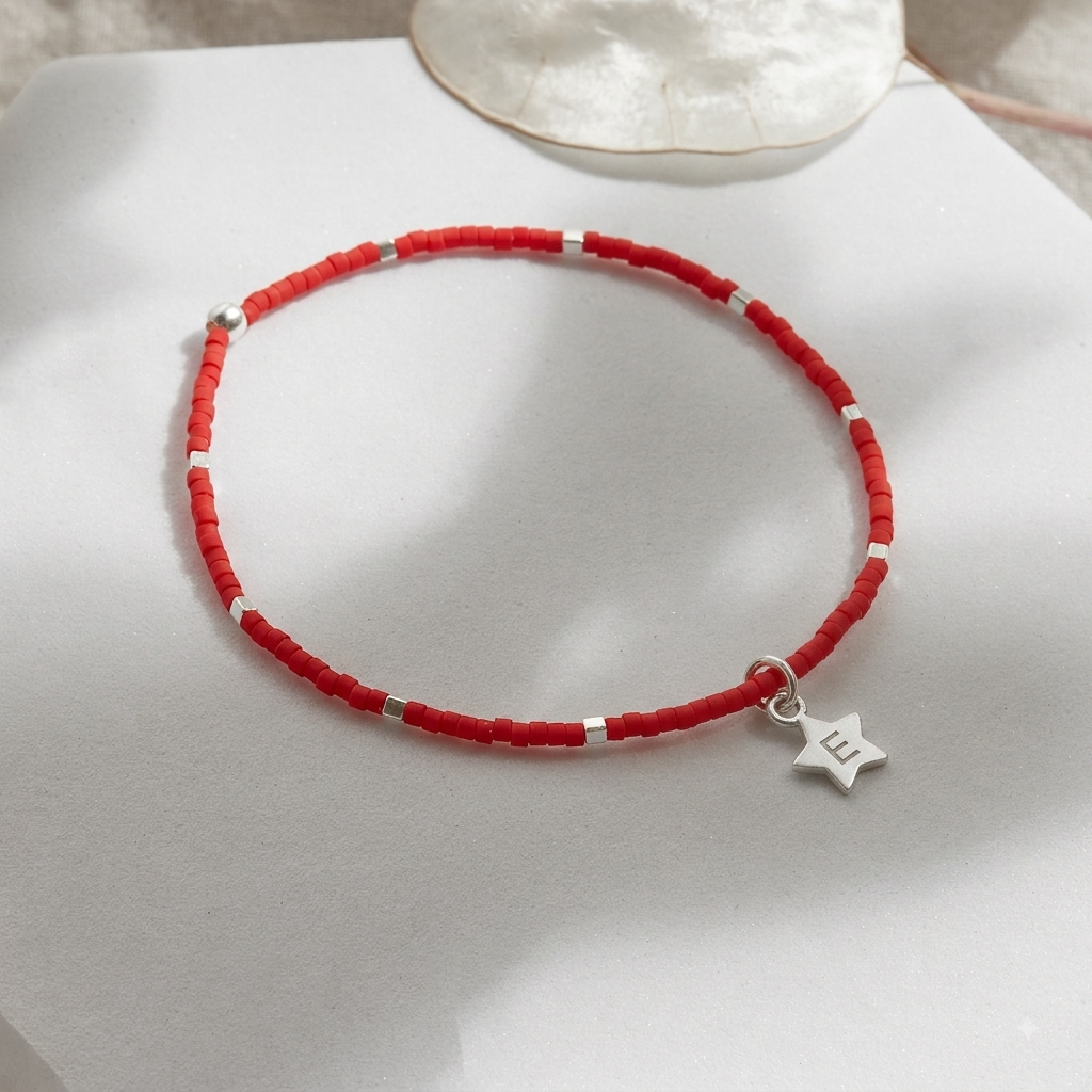 PULSERA ROJA ELASTICADA PLATA INICIAL ESTRELLA
