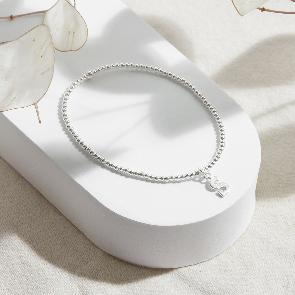 PULSERA ELASTICADA PLATA INICIAL FORMA