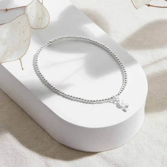 PULSERA ELASTICADA PLATA INICIAL FORMA